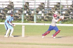  WI middle order batsman Ramnaresh Sarwan brings up his half century with a drive through covers but GCC still went down by four runs to GNIC yesterday. (Orlando Charles photo)
