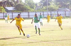 On the ball! This Lethem player chases  the ball with an East Coast player in hot pursuit when the two teams clashed yesterday in the GFF Inter-Association Women’s League at the Tucville ground. (Orlando Charles photo)  