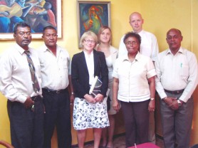 AFC executive members including Chairman Khemraj Ramjattan, (first, left) and Sheila Holder (second, right) pose with members of the Norwegian delegation here to discuss aspects of the Guyana/Norway partnership on the Low Carbon Development Strategy (LCDS). 