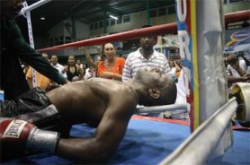 Lights out! Trinidad and Tobago’s Kevin Placid is knocked out cold by Howard Eastman in what could have been avoided if referee Eion Jardine had stopped the fight after the first knock down (Orlando Charles photo) 