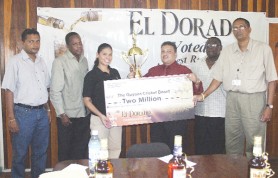 Brand Manager of DDL, Maria Munroe, hands over the sponsor’s cheque to GCB Vice President Bissondyal Singh while other GCB executives look on. (Orlando Charles photo)    