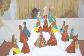 Mini beauties: the dolls in this photo are dressed in custom made clothing representing the various cultures present in Guyana. They were being display for sale at GuyExpo 2009 last evening. 