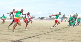 No photo finish in this upset! GDF’s Quincy Clarke (right) dips at the line ahead of Rupert Henry (left) and Keith Roberts (centre) in the 200m final of the Joint Services championships yesterday at Camp Ayanganna ground.    