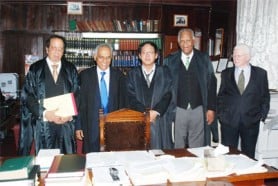 Chartered Accountant and Stabroek News columnist Christopher Ram (second from left) was yesterday admitted to practice at the Guyana Bar as an Attorney-at-Law. His petition was accepted by Chief Justice Ian Chang (centre). In photo, Ram is also flanked by Senior Counsel Eddie Luckhoo (left), Rex McKay (second, right) and Miles Fitzpatrick (right).