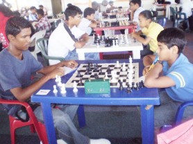 At the recent National Qualification Chess Tournament, Crystal Khan (R) was the only female to qualify for the National Chess Championships. She will play in the Junior category of the championships. By being one of the top six finishers of the tournament among the Juniors, Crystal also qualified to represent Guyana at the Inter-Guiana Games to be held in Paramaribo next weekend. Crystal is the daughter of veteran chess player David Khan, and sister of Taffin Khan, who will play top board for Guyana in the triangular team tournament (Guyana, Suriname and French Guiana) in Parimaribo. In photo, Crystal ponders her move in her game with Julia Clemensen.