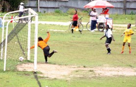 Georgetown Association’s Charmaine Warde strikes her team’s winning goal against Bartica Sunday last (Orlando Charles photo) 