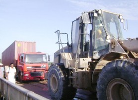 Bosai to the rescue, the front-end loader towing the truck off the middle span of the bridge.    