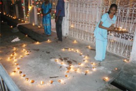 Diyas being lit in Alexander Village
