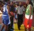 President of Suriname Dr. Ronald Venetiaan being assisted by Guyana’s FIBA referee Lugard Mohan on a jump ball between Suriname and French Guiana which officially marked the 2009 IGG second opened. (Rawle Toney photo) 