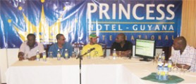 Guyana’s captain Ramnaresh Sarwan (centre) makes a point during the press briefing at the Princess Hotel. Clive Lloyd (left), Ramsey Ali (2nd L), Andrew Mason (Right) and Barry Wilkinson (2nd R) look on. 