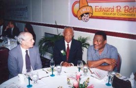 David de Caires, Ken Gordon and Prime Minister Samuel Hinds share a table at a Guyana Manufacturers Association dinner.
