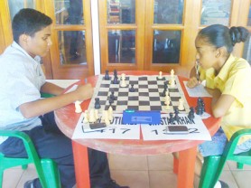 Among the junior players participating in the National Chess Championships, West Demerara’s Crystal Khan is the lone female. Recently, she represented Guyana at the Inter-Guiana Games in Paramaribo. In photo, she faces Raan Motilall, a student attending St Stanislaus College, who recently began playing the game competitively.