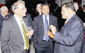 Having a cricketing word – ICC CEO Haroon Lorgat (left) shares a light conversation with Guyana Cricket Board (GCB) President Chetram Singh (right) and Secretary Anand Sanassie at the WT20 ticket sales launch in Barbados on Saturday.   