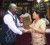 Marcel Hudson (left) receives a plaque in the shape of the town’s map from Vice-Chairman of the Regional Education Committee, Thelma Lieu King. 