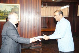 New Turkish Ambassador Nihat Akyol presents his letter of credence to President Bharrat Jagdeo on Monday at the Office of the President