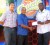 Director of Operations at Church’s Chicken Gregory De Gannes (centre) hands over the sponsorship cheque to Aubrey ‘Shanghai’ Major (right) while K&S Co-Director Kashif Muhammad (left) looks on. 