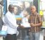 Managing Director of Cell Phone Shack Paul Low-Koan (second right) hands over his company’s sponsorship to Aubrey Major yesterday while Operations Manager, Paul Parasram (L) and Kashif Muhammad (R) display a few items.  