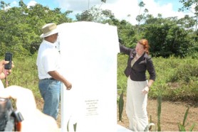 Minister of Tourism, Industry and Commerce Manniram Prashad and Charge d Affaires of the Embassy of the United States of America Karen Williams unveiling the  plaque at Jonestown. (GINA photo)