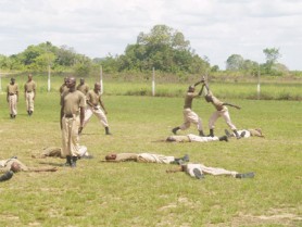 New army recruits demonstrate unarmed combat before their graduation on Thursday. According to the Guyana Defence Force (GDF), 80 newly trained soldiers successfully completed the GDF Basic Recruit Course and graduated at the Colonel John Clarke Military School at Tacama. Army Chief of Staff Commodore Gary Best, during his address, told the new soldiers that they have committed themselves to the ultimate sacrifice, which meant giving their lives if possible, in defence of the country.  He told the soldiers that as bearers of the GDF uniform, they have a critical mandate to the security and stability of the nation. “You must now exercise foresight, display wisdom, and act in a responsible manner in whatever you do. You must demonstrate that you are prepared to uphold the values of the Force: service, dedication to duty, selflessness, honour and integrity,” Best said. He warned: “From this point forward, your true test begins. We shall soon be aware of how much you have learnt. Your actions ‘will speak about you’ and allow us to make the necessary judgments. Do not misplace the trust and confidence others have in you nor abuse the authority you have as soldiers. If your goals are not compatible with the goals of the GDF, then your stint with us is going to be a very short one.” Best also emphasised that the soldiers must display respect for all the citizens of Guyana regardless of their station in life. “Citizens must be able to say, I feel safe, our soldiers are around,” he stressed. The soldiers were trained in the basics of soldiering and will benefit from other aspects of training when posted to the various Units of the Force, the release stated.  