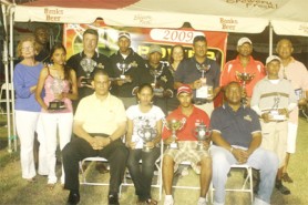 The prize winners and officials of Banks DIH Limited at yesterday’s Guyana Open golf tournament. (Orlando Charles photo)