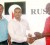 Financial Director of Rusal Bauxite Company, Ramdeo Kumar (centre), hands over the sponsorship cheque to Co-Director of the K&S Organization Aubrey ‘Shanghai’ Major (right) while Kashif Muhammad looks on at left. 
