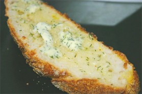 Warm, crusty bread with herbed butter (Photo by Cynthia Nelson)