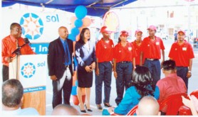 Sol Guyana General Manager Ken Figaro introduces the dealer of the new Corriverton Service Station and the pump attendants. 