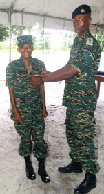 Woman Private Melika Scotland receiving her paratrooper’s wings from Captain Sheldon Howell (GDF photo)