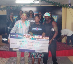 Courts (Guyana) made another customer a millionaire when its Stash of Cash 3 promotion continued on Wednesday. Wineth Sertimer (centre) won $1.1M in the promotion. She received her cheque from the Director of Purchasing and Customer Services Clyde De Haas (left). Every purchase of $5,000 and over earns customers a double entry into the promotion. Drawings are held every Wednesdays live on NCN radio and television and customers get a chance to win up to $2M.
