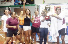 Carnival time! Trinidad and Tobago’s Malvern Hockey club in celebration while receiving their trophy for winning the 2009 GHB’s Diamond Mineral Water International Indoor Hockey Festival (Orlando Charles photo)