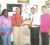 President of the GLTA, Christopher Ram, hands over the plaque to Bish Panday in the presence of GLTA’s secretary, Grace Mc Calman and Mrs. Panday.