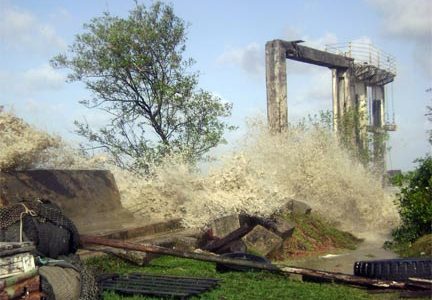 The spring tide pounded the seawall and a koker behind Ogle, East Coast Demerara yesterday. (See story on centre pages) 