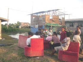 Residents of Stewartville, Sea View, West Demerara contemplate their next move after water overtopped the seawall and flooded their homes and their yards. (Alva Solomon photo) 