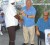 Not a hold-up: Guyana Gold and Diamond Miners Association member Patrick Pereira (centre) demonstrating yesterday how new mining regulations will emasculate the industry. At right is Executive Director of the body Edward Shields. (Jules Gibson photo) 