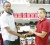 Managing Director of Fitness Express, Jamie McDonald, (left) makes the presentation to promoter Carwyn Holland. (Rawle Toney photo)