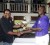 Guyana Beverage Country Manager Robert Selman presents MSC captain Neil Barry right  with the championship trophy. (Orlando Charles photo)    