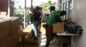 Volunteers pack boxes of clothing that were shipped to Haiti on Tuesday afternoon.  