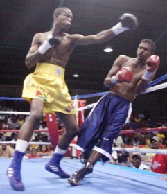 Feel my power! Debutant fighter Clive Atwell unleashed his left hand power on Charlton Skeete and floored him twice in the first round.  (Orlando Charles photo)  