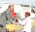 President Bharrat Jagdeo presents Second Lieutenant Texine Daw with her best cadet runner-up prize. (Jules Gibson photo)  