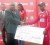 Captain of Zimbabwe Prosper Utseya receives the winning cheque from acting President of the GCB Faizul Bacchus. (Orlando Charles photo)