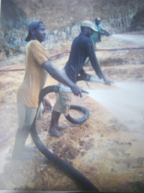 The late  Karan Roopnarine (second left)  and colleagues  at work in a mining pit.