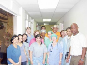 Members of the visiting New York team after successfully completing three paediatric heart surgeries at the Caribbean Heart Institute (CHI) take time out for a photograph. At extreme left is Director of CHI Dr Gary Stephen and next to him is head of the team, Dr Sheel Vatsia. At the back (with hat) is businessman George Subhraj who was instrumental in making the paediatric surgeries possible. (Alva Solomon photo)