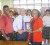 The Rotary Club of Georgetown recently donated a set of literature books to the library of Marian Academy.  In this photograph, past president of the club Affeeze Khan (centre) hands over some of the books to Cheryl Andrews, the Secondary Co-ordinator of the school. Rotarian Gary Thompson (left of Khan), teachers and students of the school look on. The books were a donation to the Rotary Club of Georgetown from Paul Chan-A-Sue. 