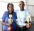 Precious Pearl and Young Bill Rogers proudly display trophies which they won after placing first and second respectively with entries they submitted to the Rajkumari Singh category of the Guyana Annual.