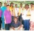 In photo, president of the ECLC, Devin Sookraj (second from right) and president of the NALC, Leila Clarke (at left) pose with other members and some of the persons who benefitted from the clinic.