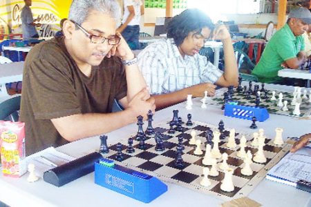 Former national chess champion  Raymond Singh ponders his next move.