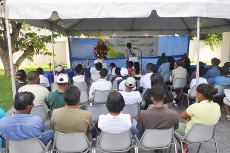 Brian Tracey addresses executive members of the Guyana Lawn Tennis Association (GLTA) parents and participants at the opening of the GBTI Open tournament at the GBTI Sports Club, Bel Air yesterday.
