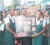 Schoolmates of slain schoolboy Kelvin Anthony Fraser hold a board with newspaper headlines of his death during a protest close to the Ministry of Home Affairs, Brickdam yesterday. 