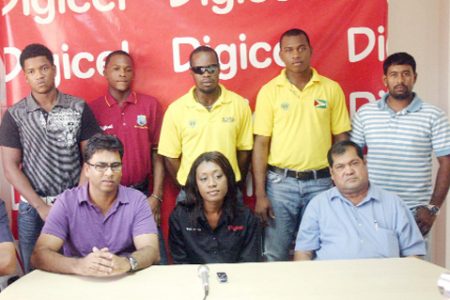 At the head table during the launching (sitting from left) are  GCB High Performance Analyst Robin Singh,  Digicel PR and Events Manager Shonnet Moore  and GCB President Chetram Singh while the five cricketers stand behind them. 