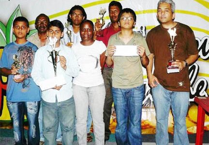 The prize winners of the latest Topco Chess tournament. Raymond Singh is at right while Taffin Khan is third from left back row.